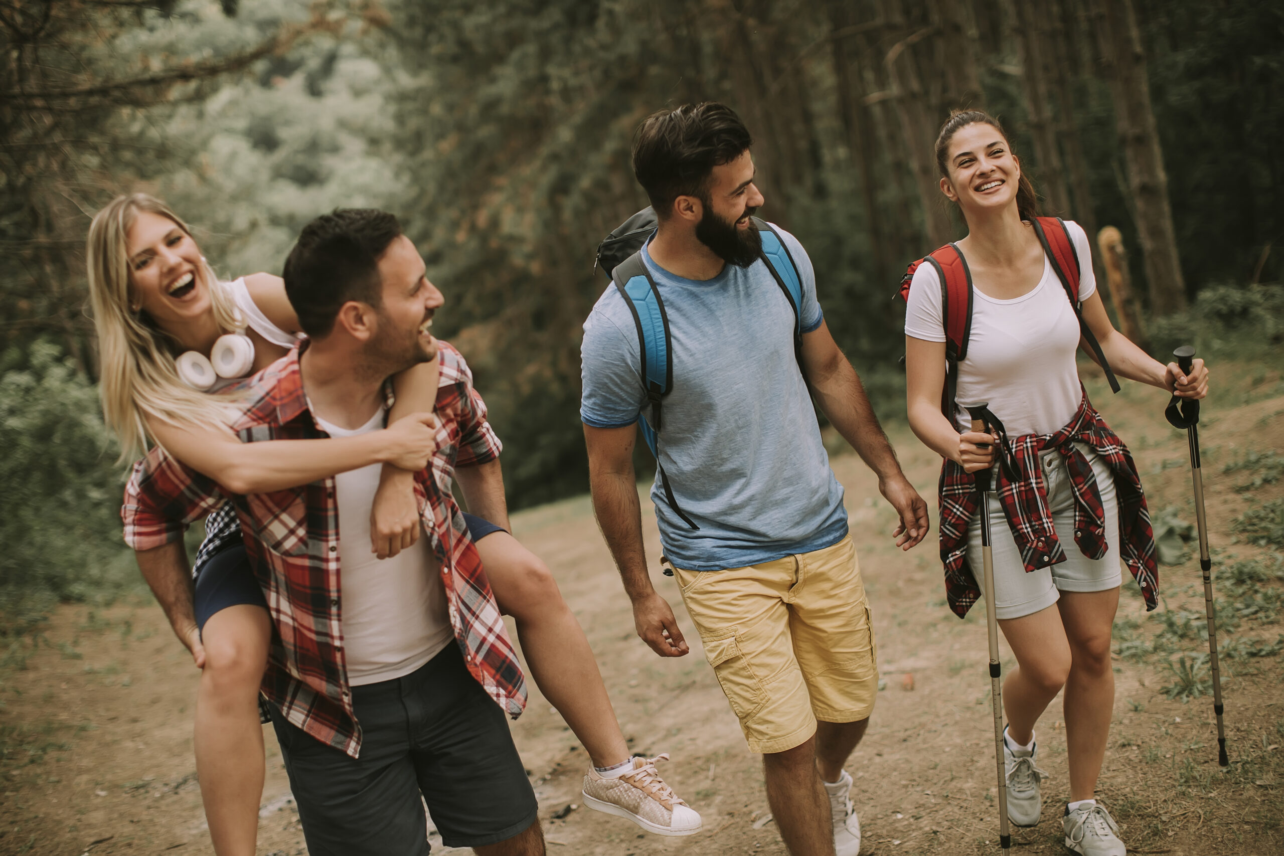 group-of-young-people-hiking-in-the-woods