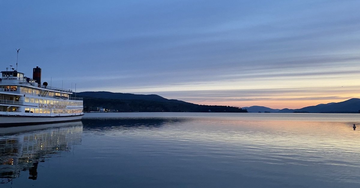 sunrise over lake, lake george steamboat cruise ship