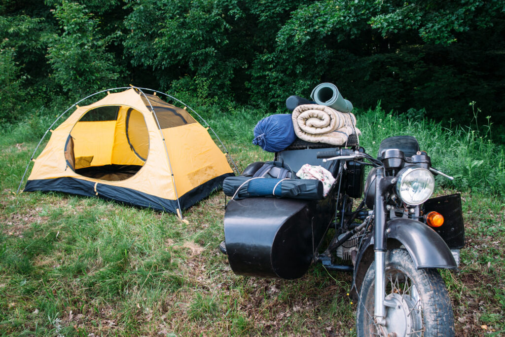 motorcycle-packed-with-gear-in-front-of-tent