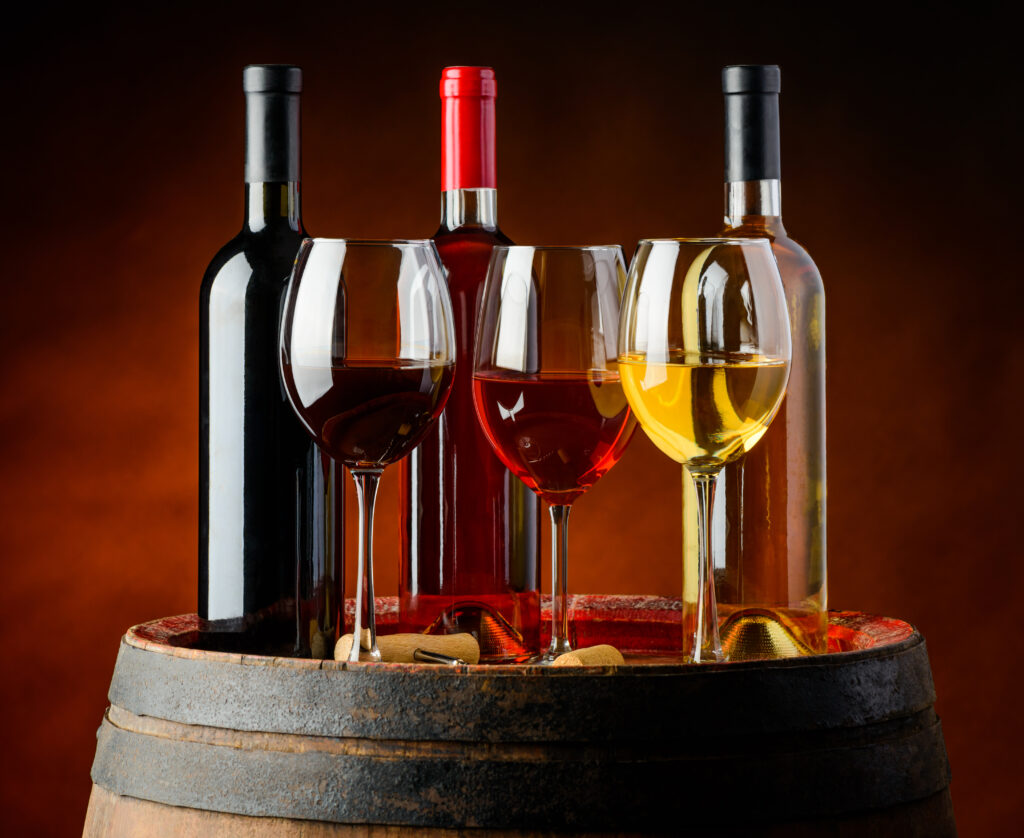 bottles-of-wine-displayed-on-barrel
