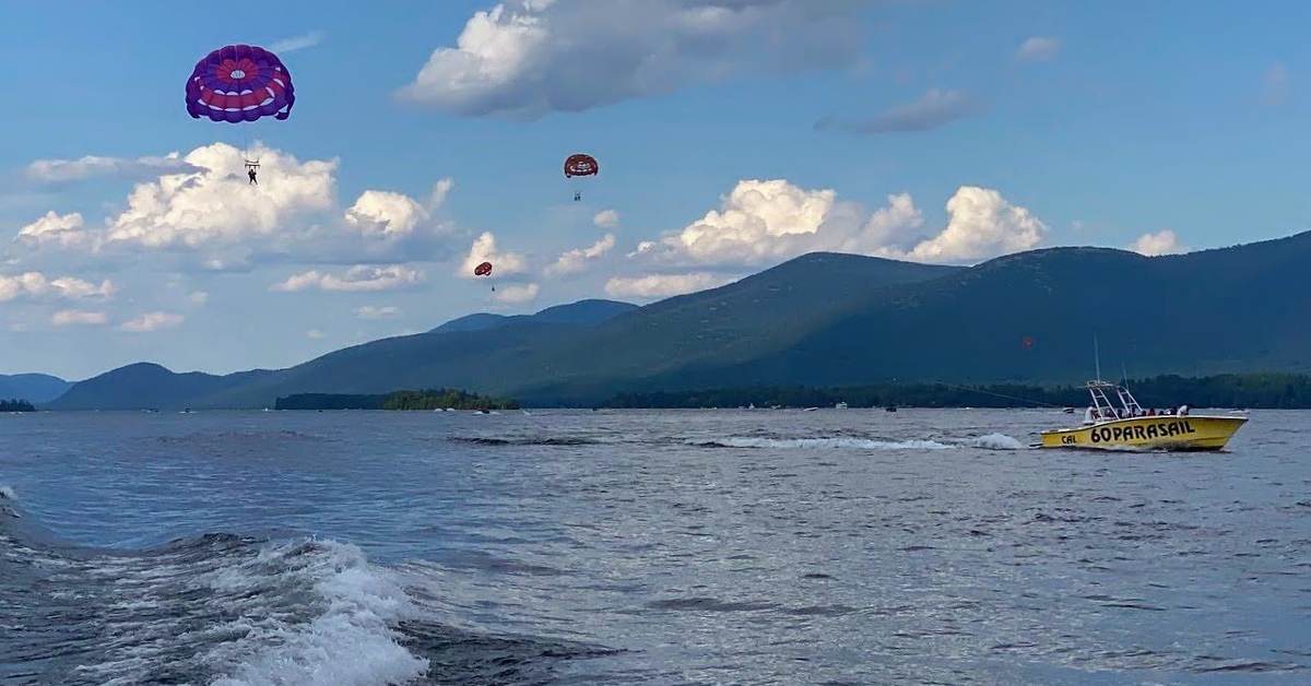 several parasailers over a lake