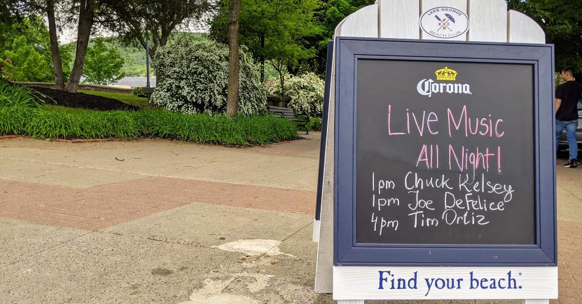 outdoor sign for live music lineup at lake george beach club