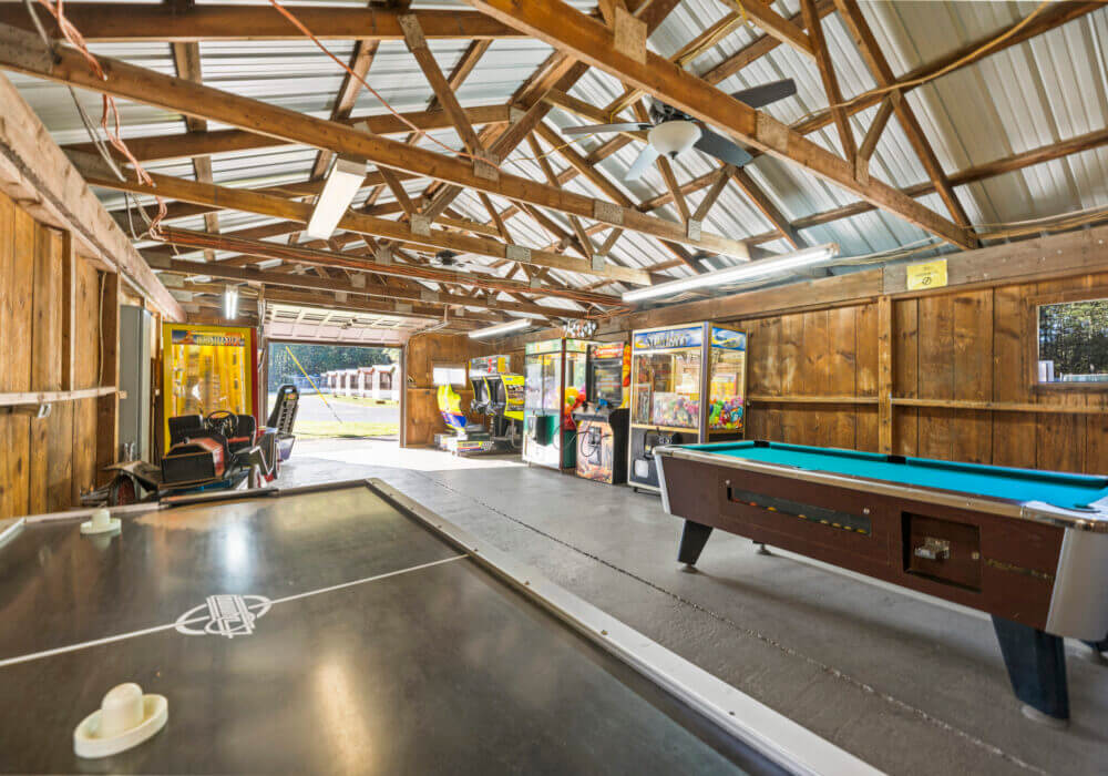 game room with foosball and pool table