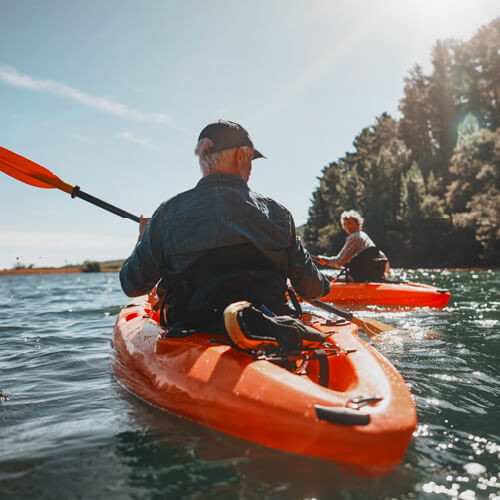 man-kayaking-on-water