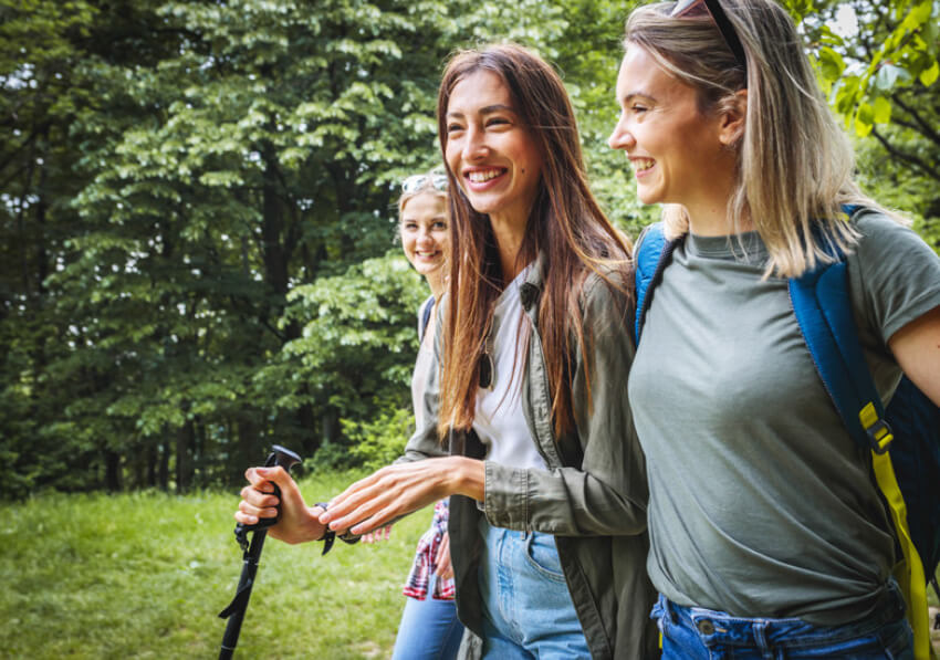 three young women hiking