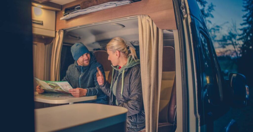 couple-in-rv-looking-at-map