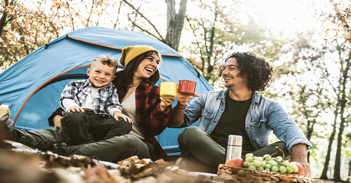 smiling-family-tent-camping-in-woods