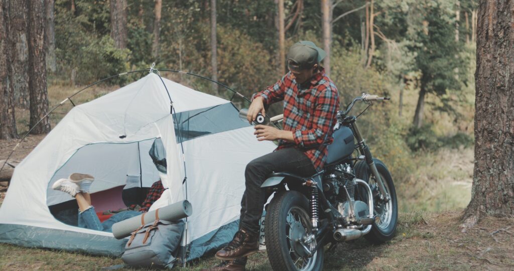 biker-couple-camping-in-forest