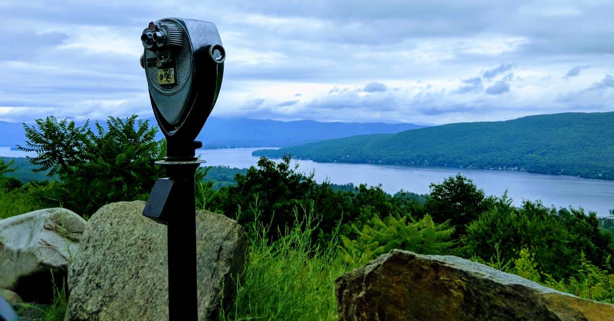 view finder on top of propsect mountain, looking down at mountain and lake views