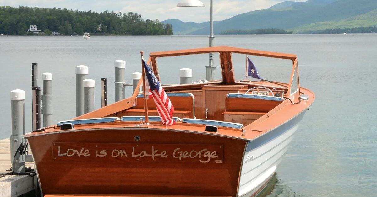 Love is on Lake George wooden boat docked on Lake George