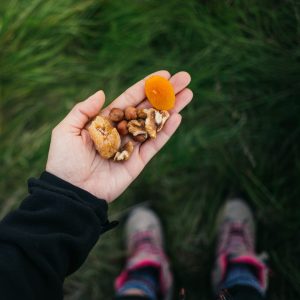 hiker holding a handful of trail mix